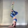 @trachoy.yoga wearing colorful yoga leggings inspired by Blue lotus flower